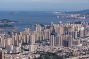 A breathtaking aerial view of Hong Kong's skyline showcasing dense skyscrapers and the harbor.
